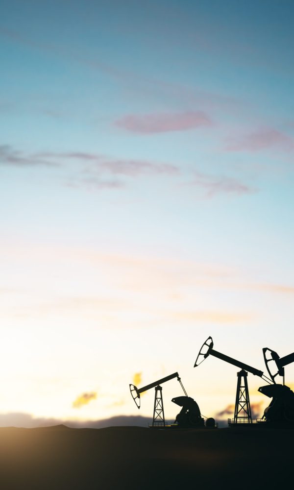 Oil production concept with oli pumps silhouettes outdoors at sunset on blue sky background Oil production concept with oli pumps silhouettes outdoors at sunset on blue sky background. 3D rendering